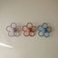 Mushie Silicone Daisy Rattle Teether - Dusty Rose on Luna Baby Store Miami