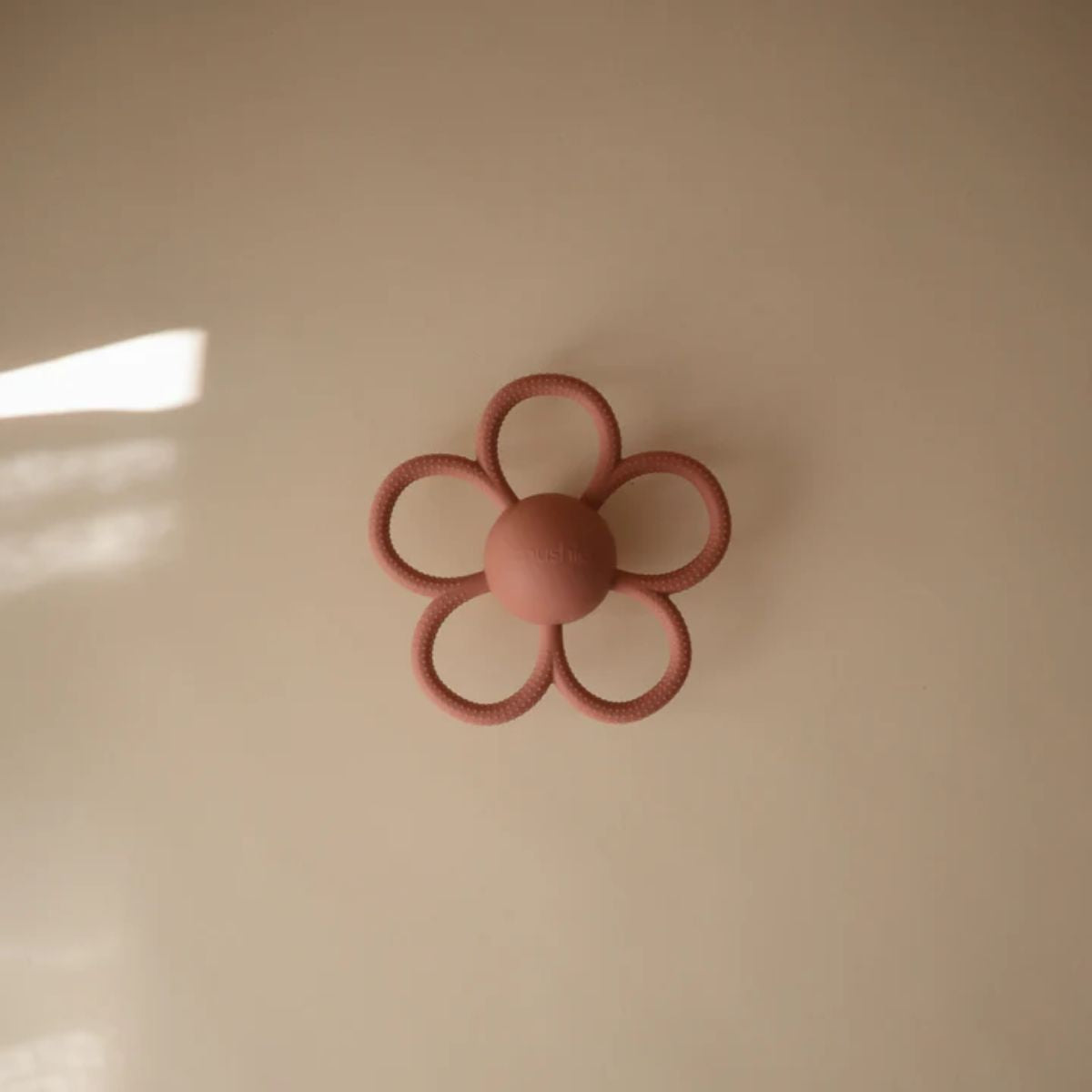 Mushie Silicone Daisy Rattle Teether - Dusty Rose on Luna Baby Store Miami